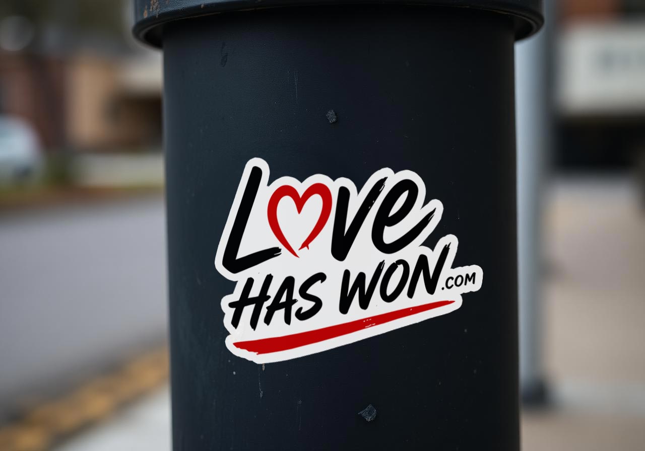 Love Has Won sticker on a lamppost
